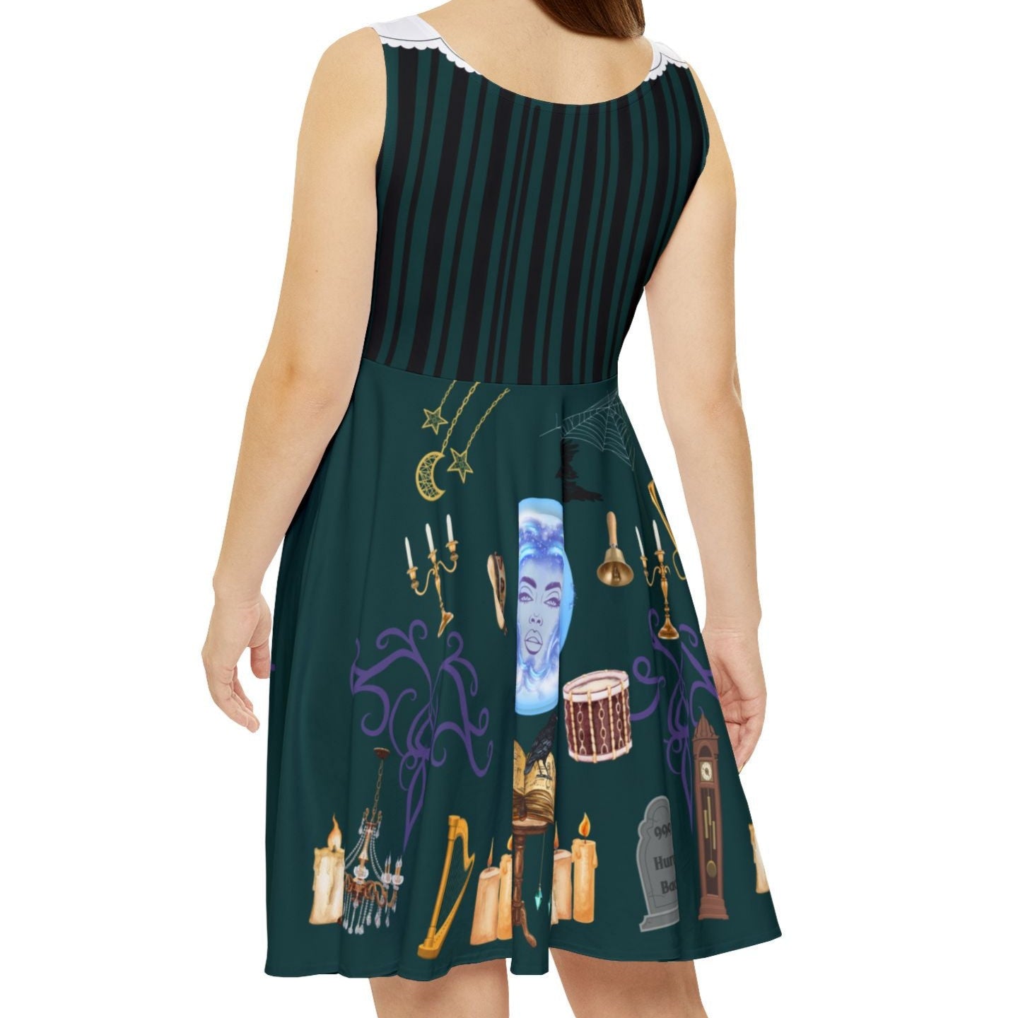 Woman wearing a Haunted mansion inspired skater dress in dark green.