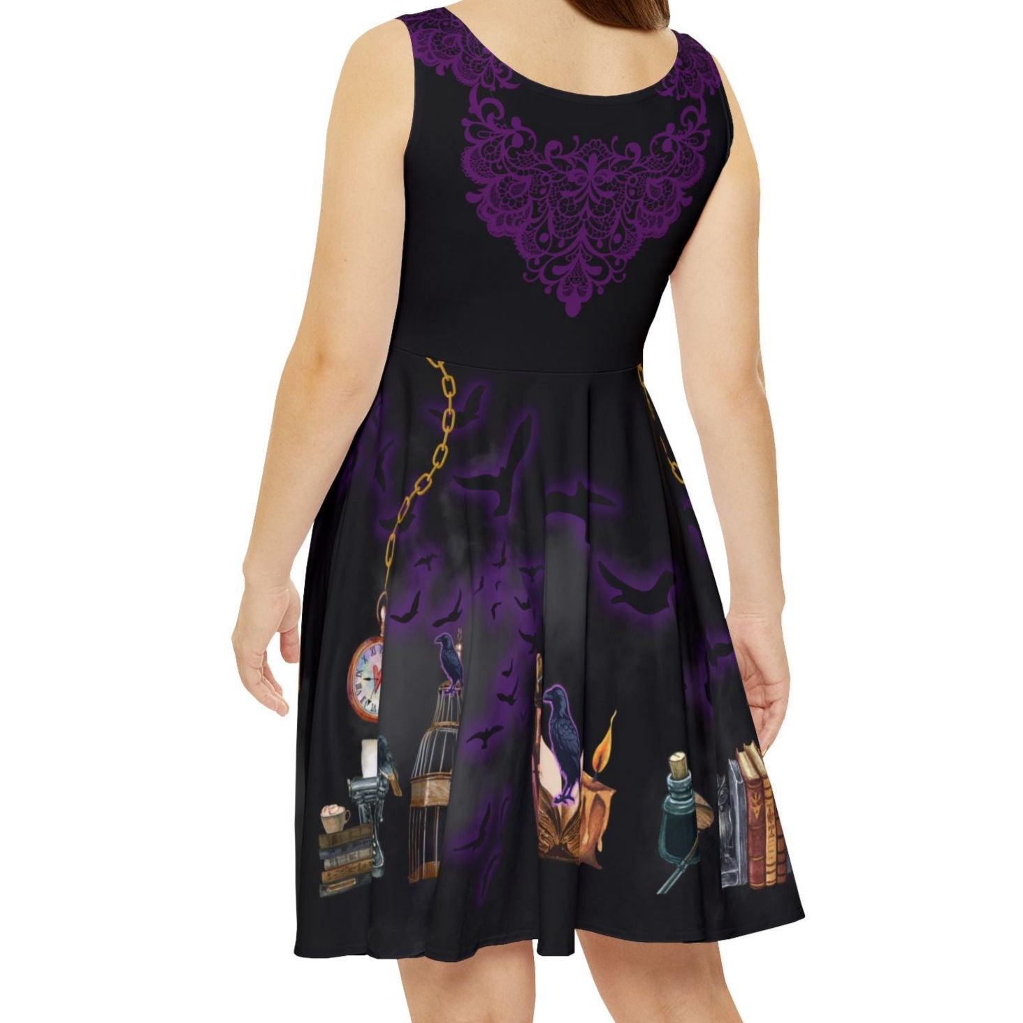 Woman wearing a black dress with purple floral patterns on a white background