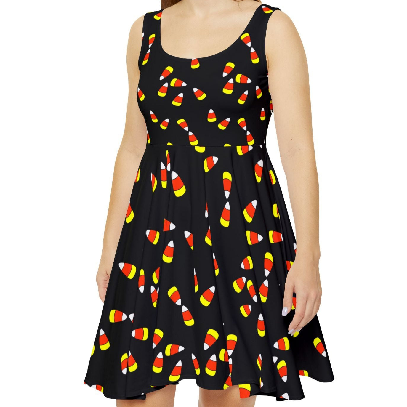 Woman wearing a black dress with candy corn pattern on it, Halloween, fall, teacher dress, fun fall dress, candy corn dress, Halloween costume alternative. 